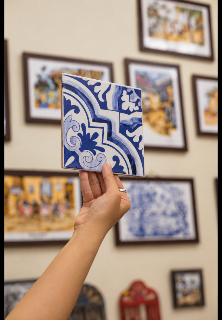 Hand-painted blue and white Azulejo tile artwork at a workshop in Panjim, Goa