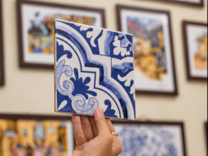 Hand-painted blue and white Azulejo tile artwork at a workshop in Panjim, Goa